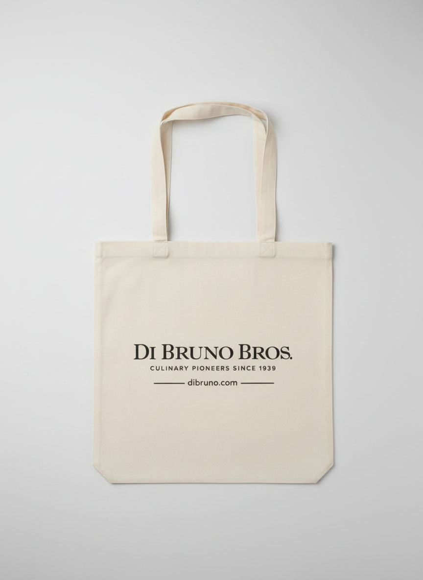 Beige tote bag with 'Di Bruno Bros.' branding on a light gray background
