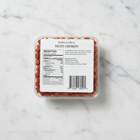 Packaged diced chorizo with a label on a gray background