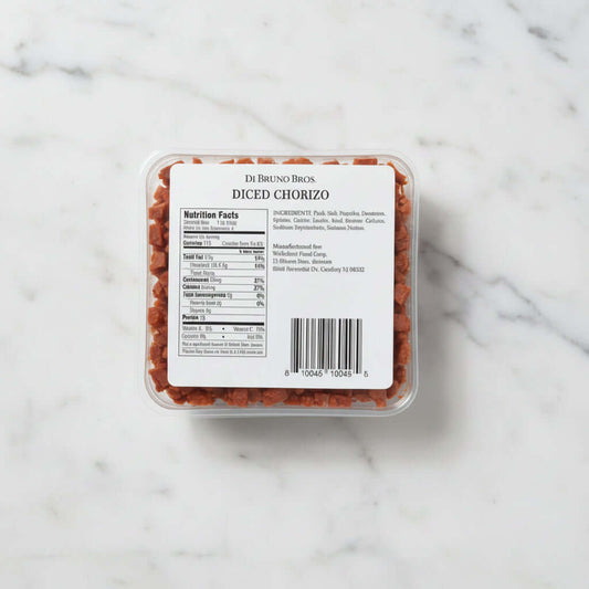 Packaged diced chorizo with a label on a gray background