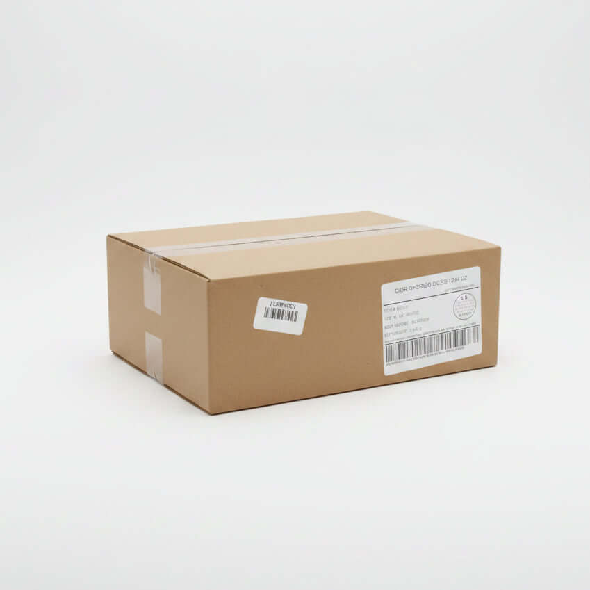 Cardboard box with labels on a concrete floor