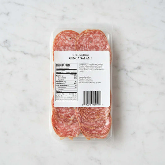 Packaged Genoa Salami with label on a dark background