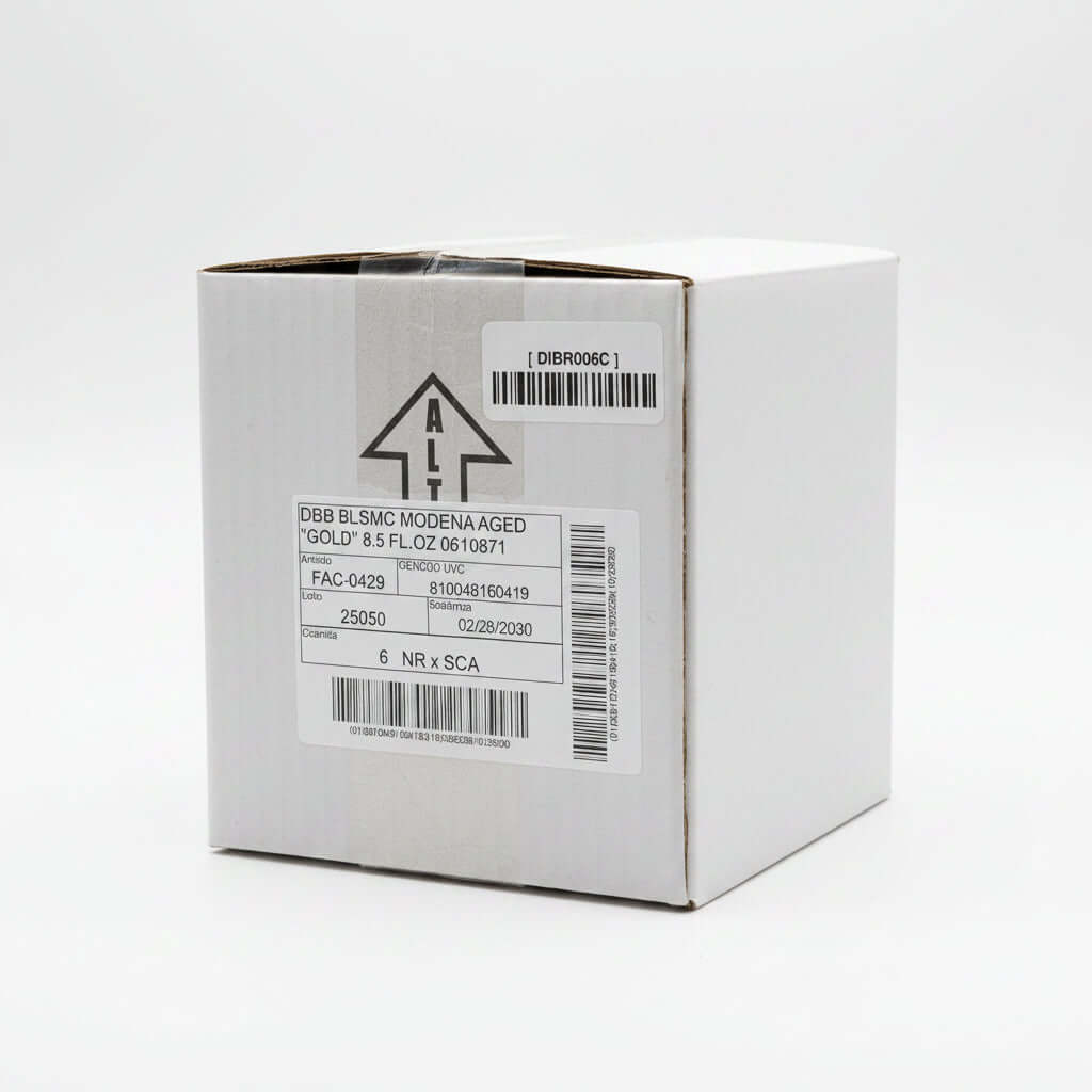 Cardboard box with labels and barcodes on a reflective surface
