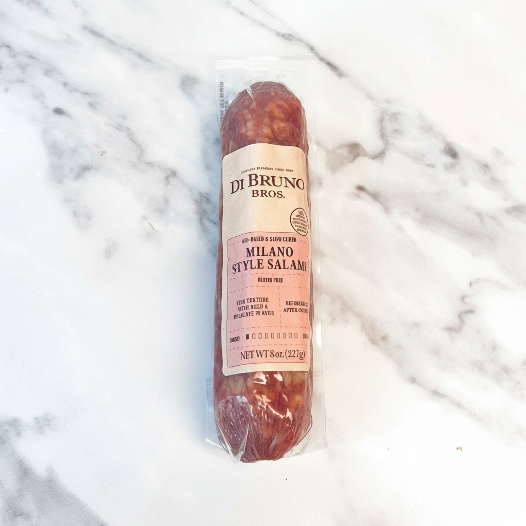 Packaged Milano Style Salami from Di Bruno Bros on a marble surface