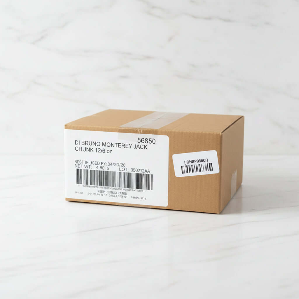 Cardboard box with 'Di Bruno Monterey Jack' label on a metal surface