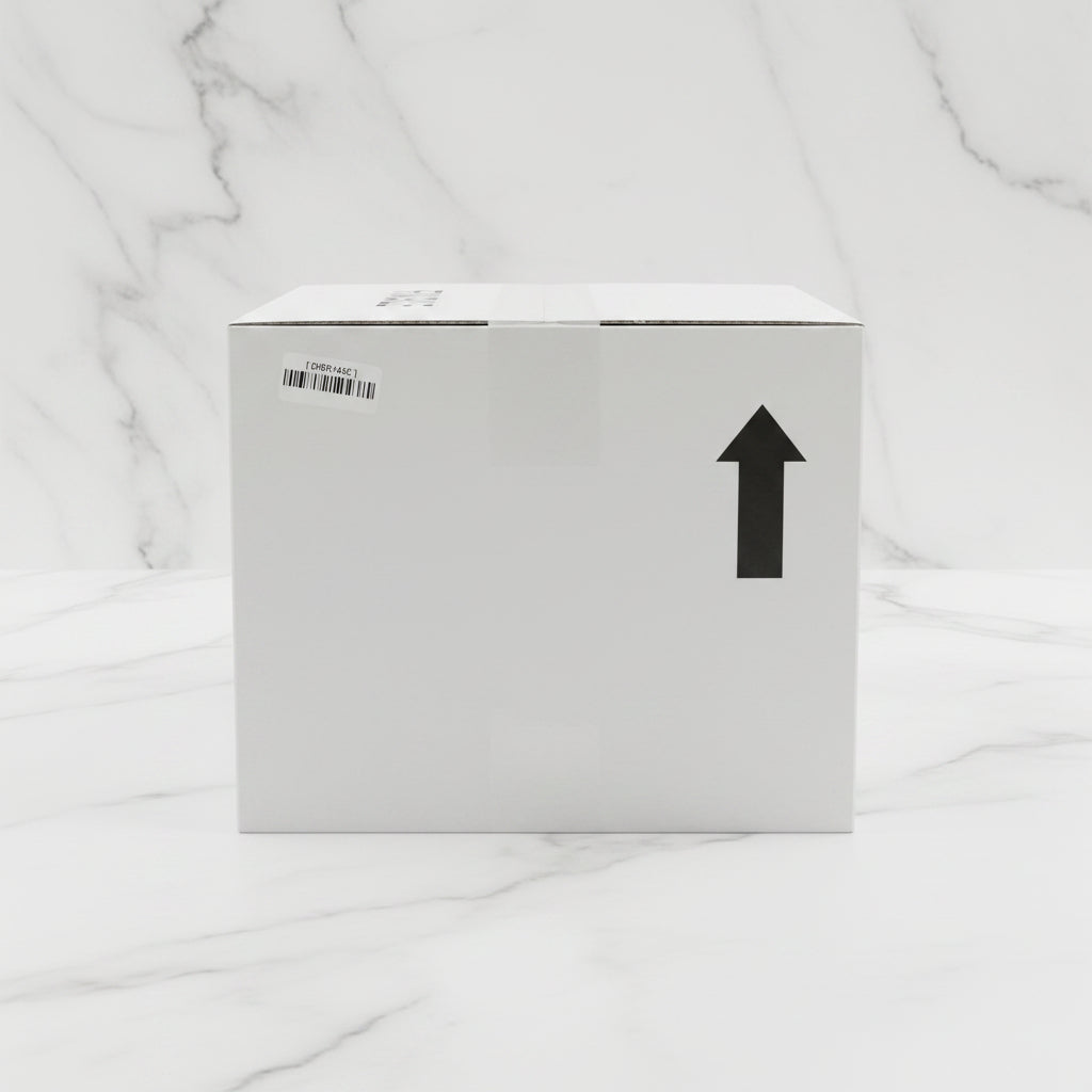 White box with a barcode label and an arrow on a warehouse floor.