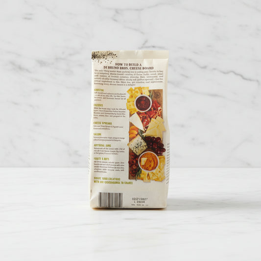 Package with cheese-themed graphics and text on a dark surface