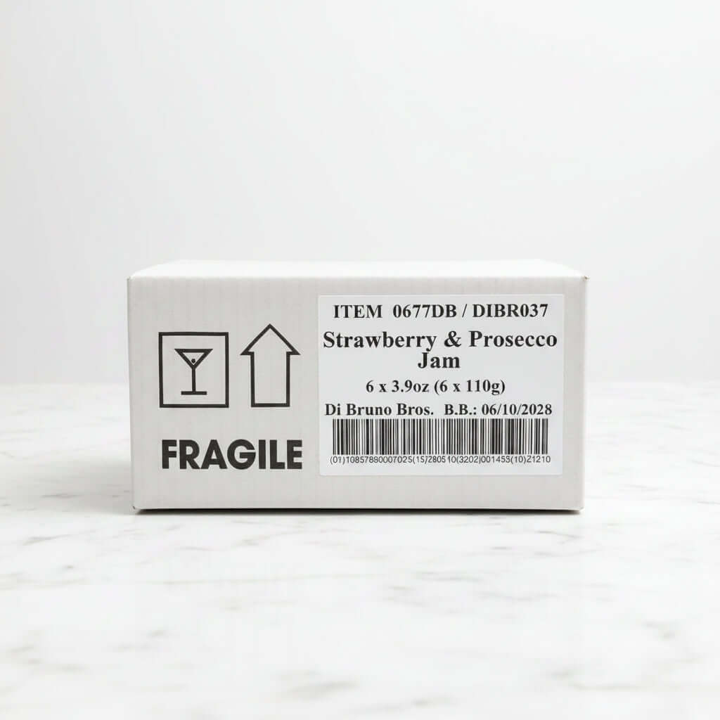 Box of Strawberry & Prosecco Jam with fragile label on a black surface