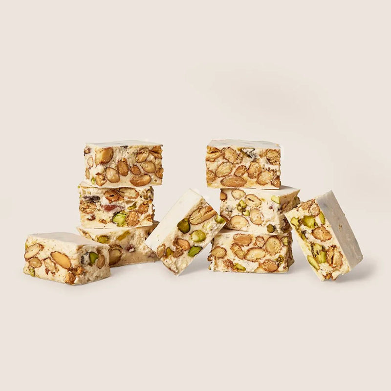 Stack of pistachio-based confectionery on a light background
