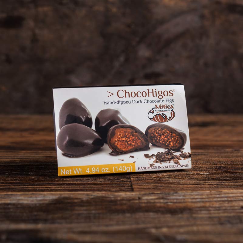 Packaging of Chocohigos dark chocolate covered figs, showing the product name and an image of the chocolate-covered figs on a wooden background.