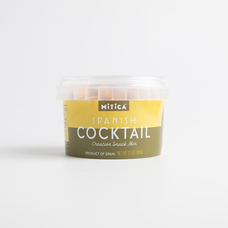 A packaged Mitica Spanish Cocktail mix, which is a container of snack mix featuring dried fava beans, chickpeas, and roasted corn kernels.