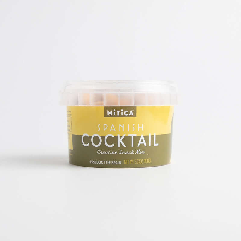 A packaged Mitica Spanish Cocktail mix, which is a container of snack mix featuring dried fava beans, chickpeas, and roasted corn kernels.