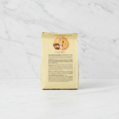 Back view of a biscuit package with text and images of cookies on a white background