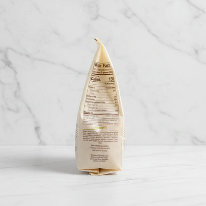 White paper bag with text on a black surface