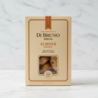 Di Bruno Bros almond biscotti packaging on a black surface with a white background