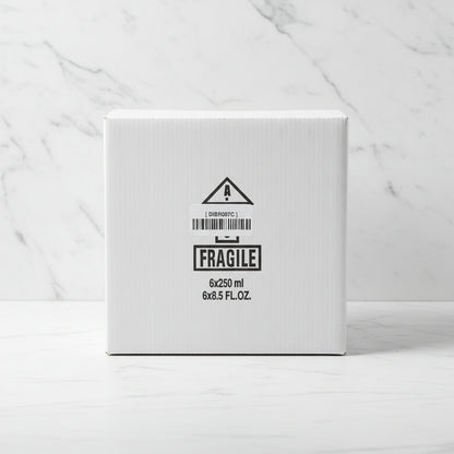 Cardboard box with a fragile label on a black surface