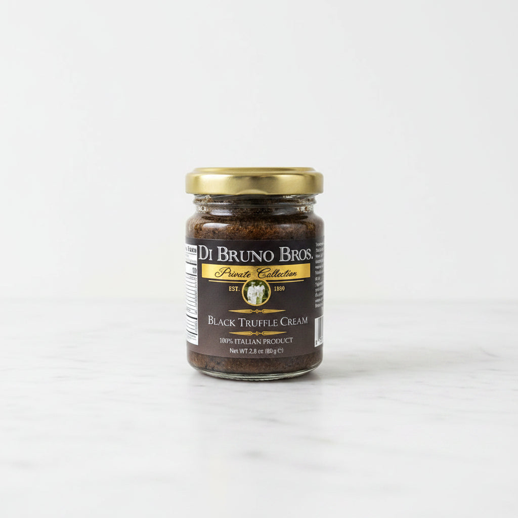 Jar of Di Bruno Bros Black Truffle Cream on a black surface with a white background