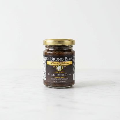 Jar of Di Bruno Bros Black Truffle Cream on a black surface with a white background