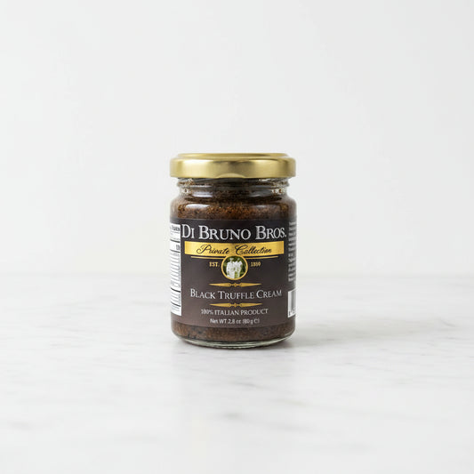 Jar of Di Bruno Bros Black Truffle Cream on a black surface with a white background