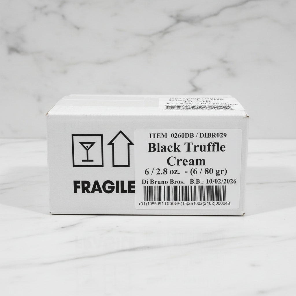 Box of Black Truffle Cream on a black surface with a white background