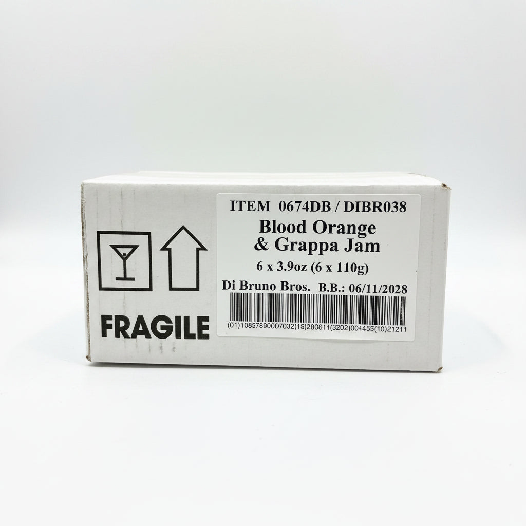 Box of Blood Orange & Grappa Jam with fragile label on a black surface