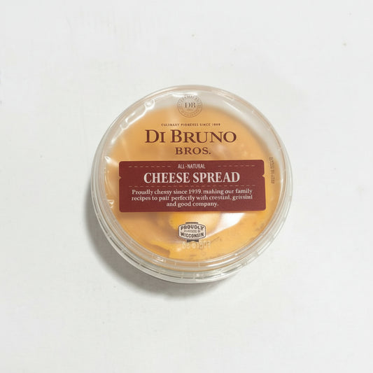 Container of Di Bruno Bros. Cheese Spread on a white surface