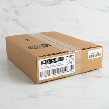 Cardboard box with Di Bruno Bros labels on a reflective surface
