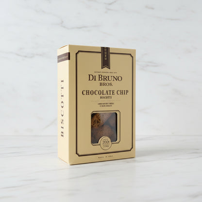 Box of Di Bruno Bros. Chocolate Chip Biscotti on a dark surface with a blurred background