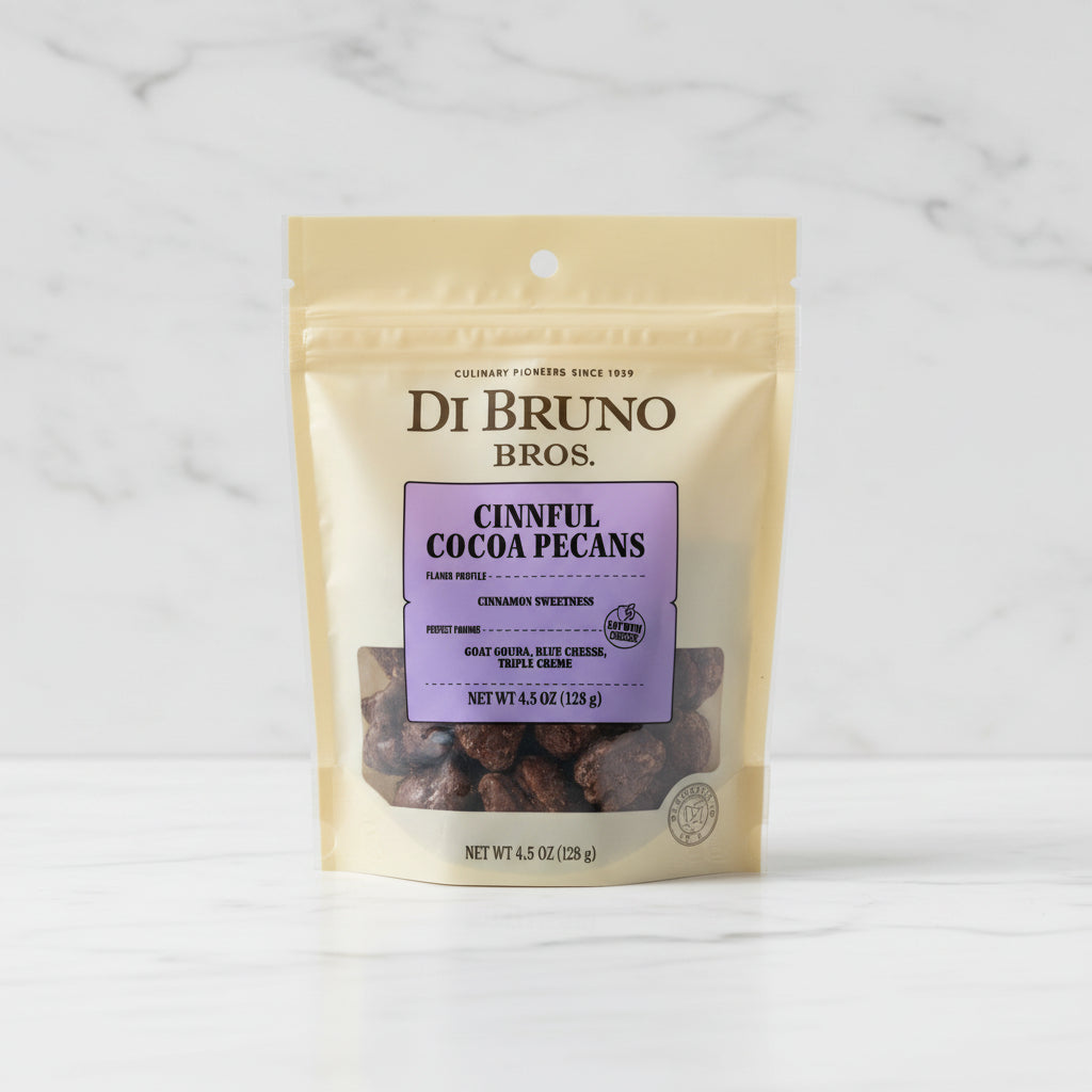 Di Bruno Bros Cinnful Cocoa Pecans package on a black surface with a gray background