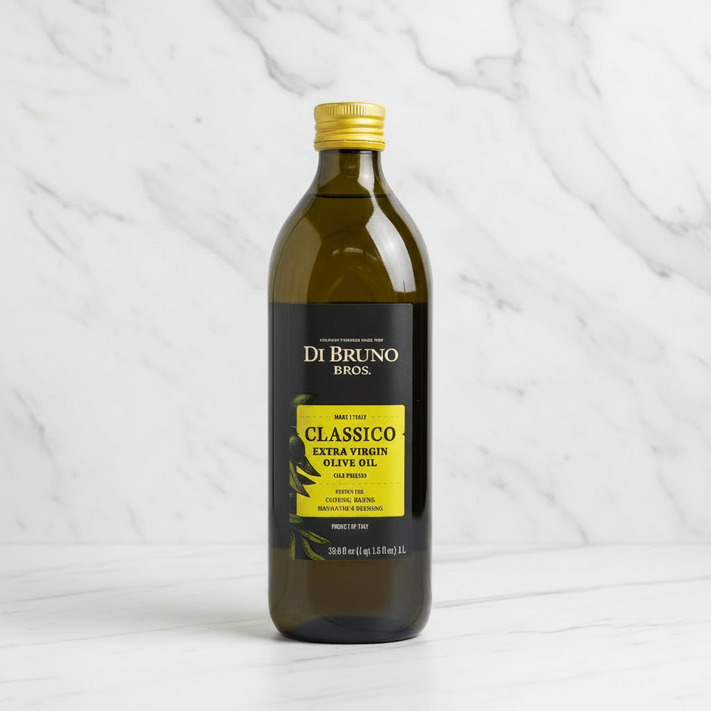 Bottle of Di Bruno Bros Classico Extra Virgin Olive Oil on a dark surface with a white background