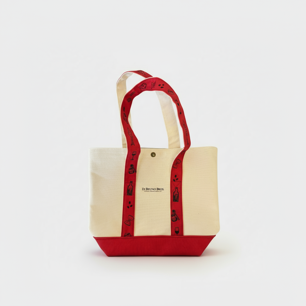 Beige tote bag with red handles and trim on a white background