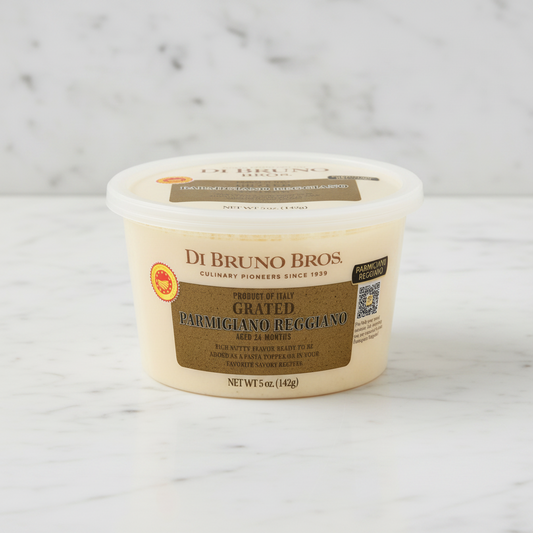 A 5 oz plastic tub of Di Bruno Bros. Grated Parmigiano Reggiano, featuring a beige container with a brown label and a clear lid, set against a plain white background.