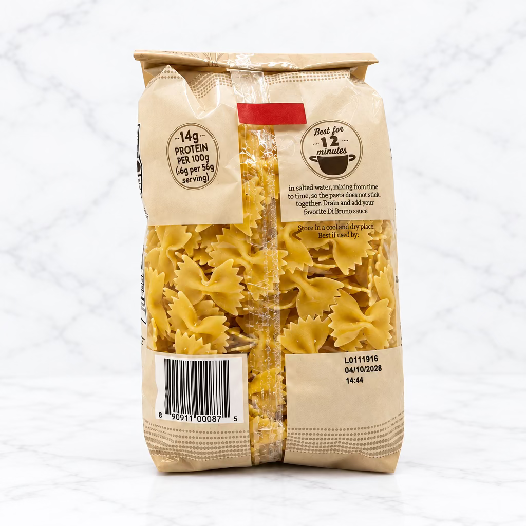 A bag of farfalle pasta on a white studio background. The package is tan paper with a clear window showing the yellow-beige pasta inside.