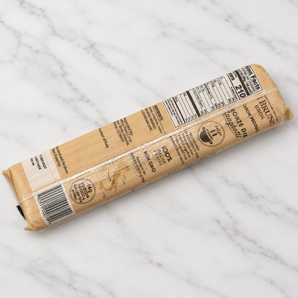A packaged stick of brown sugar, showing the nutrition facts and product details on its clear plastic wrapper, resting on a white surface.