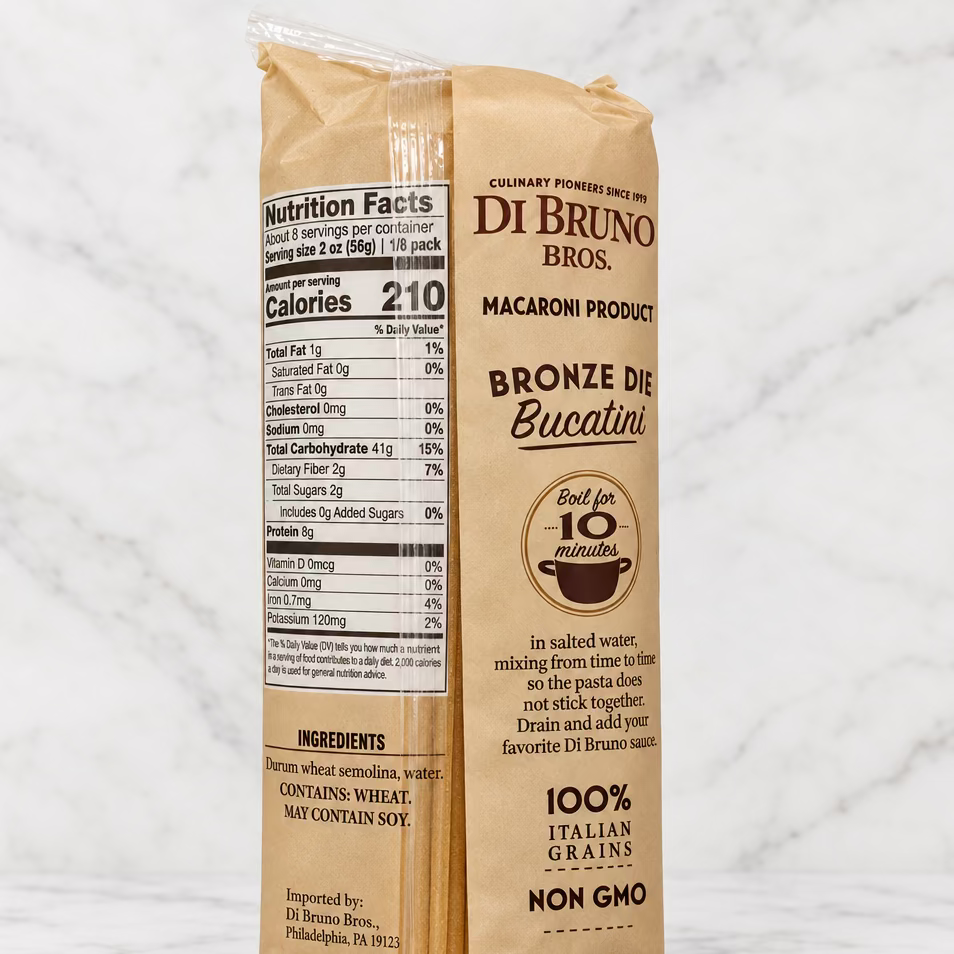 A bag of Di Bruno Bros. Bronze Die Bucatini macaroni pasta, showing the nutrition facts panel and product details on a plain white background.