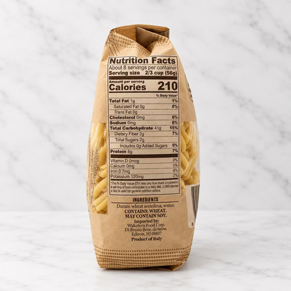 A bag of pasta shown from the back, displaying the nutrition facts panel and ingredients list on a white background.