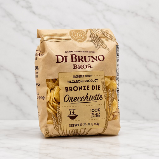 A bag of Di Bruno Bros. Bronze Die Orecchiette macaroni pasta, shown on a plain white studio background.