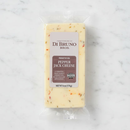 Packaged pepper jack cheese from Di Bruno Bros on a white background