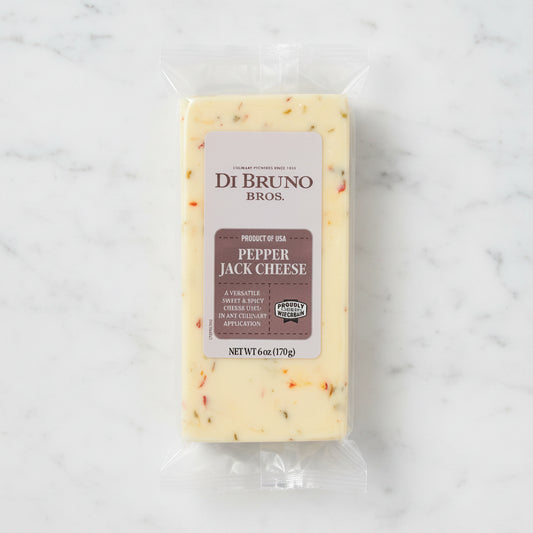 Packaged pepper jack cheese from Di Bruno Bros on a white background