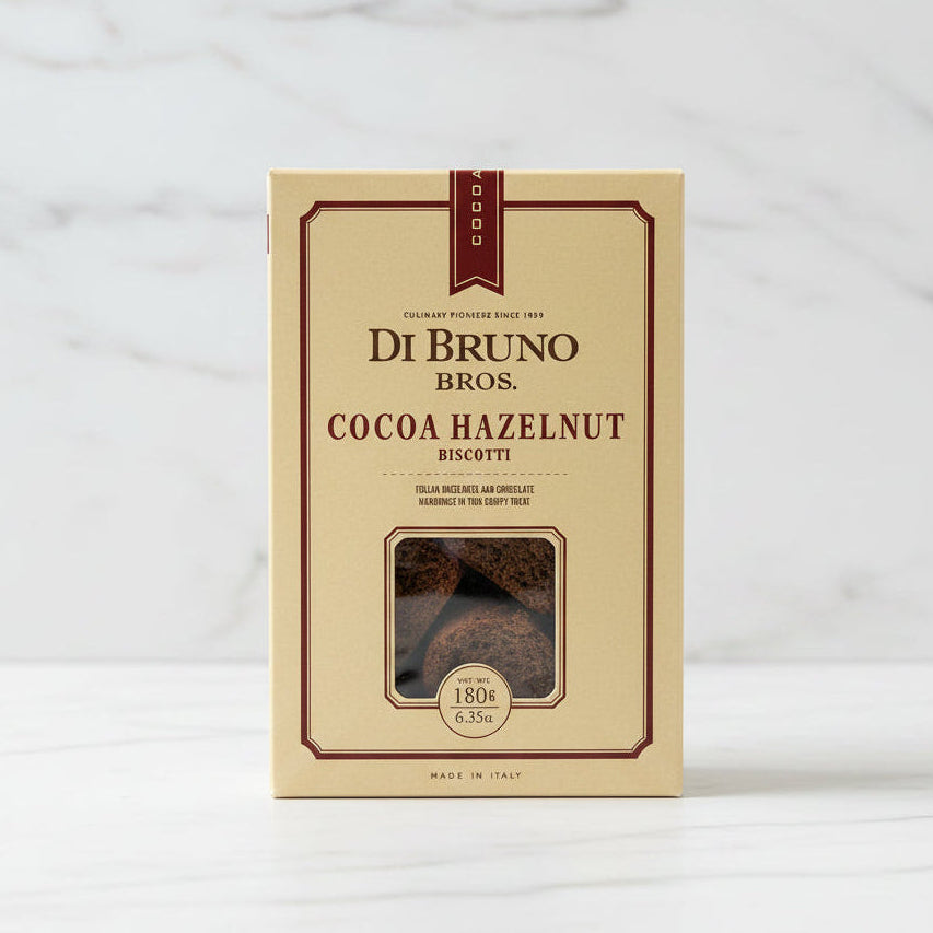 Box of Di Bruno Bros. Cocoa Hazelnut Biscotti on a black surface with a white background