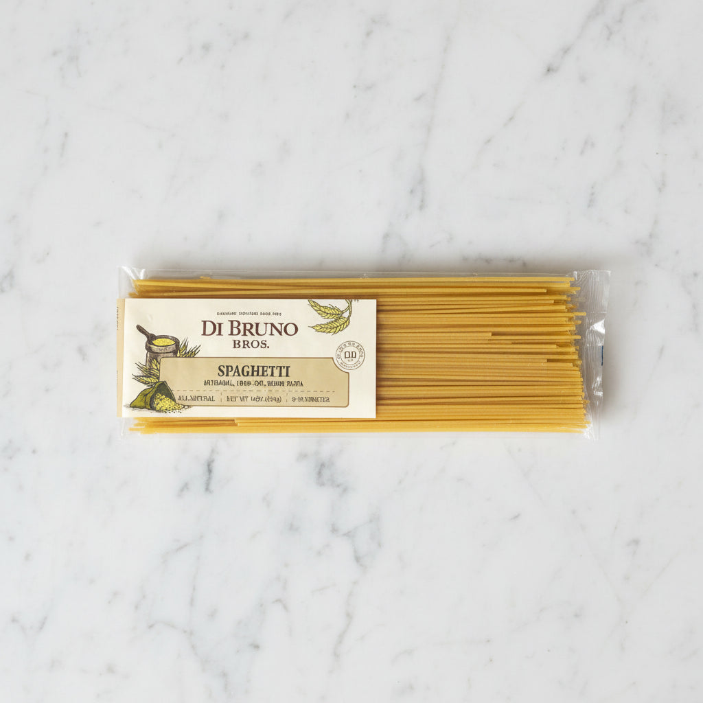 Packaged spaghetti with Di Bruno Bros label on a gray background