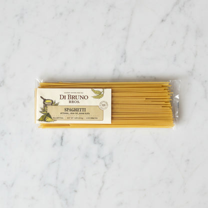 Packaged spaghetti with Di Bruno Bros label on a gray background