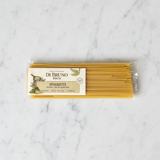 Packaged spaghetti with Di Bruno Bros label on a gray background