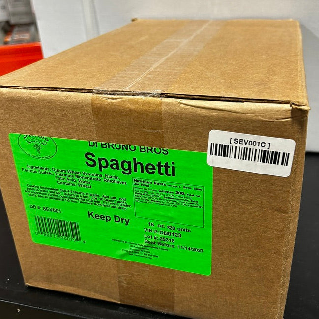 Cardboard box with a green label indicating 'Spaghetti' on a black surface.