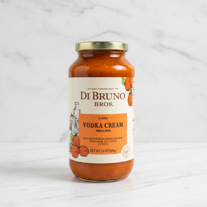 Jar of Di Bruno Bros Vodka Cream tomato sauce on a black surface with a white background