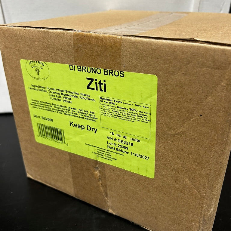 Cardboard box with a green label on a black surface