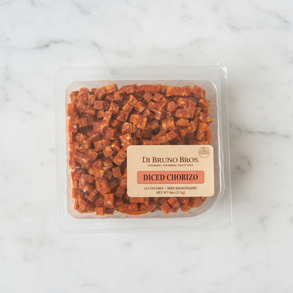 Packaged Diced Chorizo by Di Bruno Bros on a dark surface