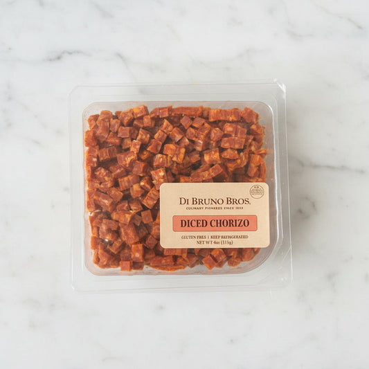 Packaged Diced Chorizo by Di Bruno Bros on a dark surface