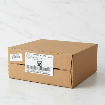 Cardboard box with labels and barcodes in a warehouse setting
