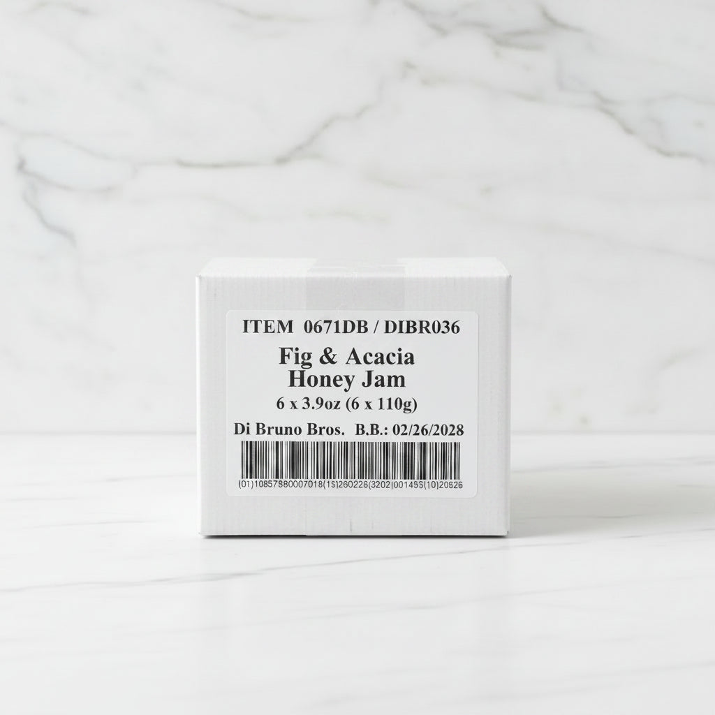 Box of Fig & Acacia Honey Jam with a label on a dark surface