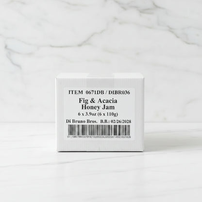 Box of Fig & Acacia Honey Jam with a label on a dark surface